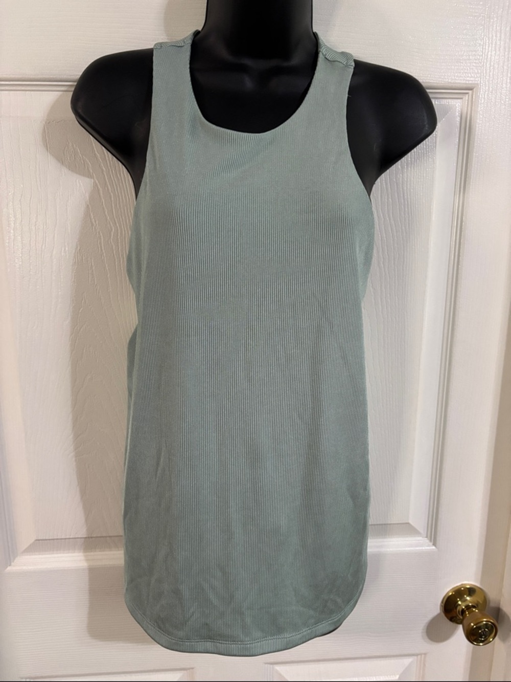 A. New Day sea foam green sleeveless tank top, size XL.